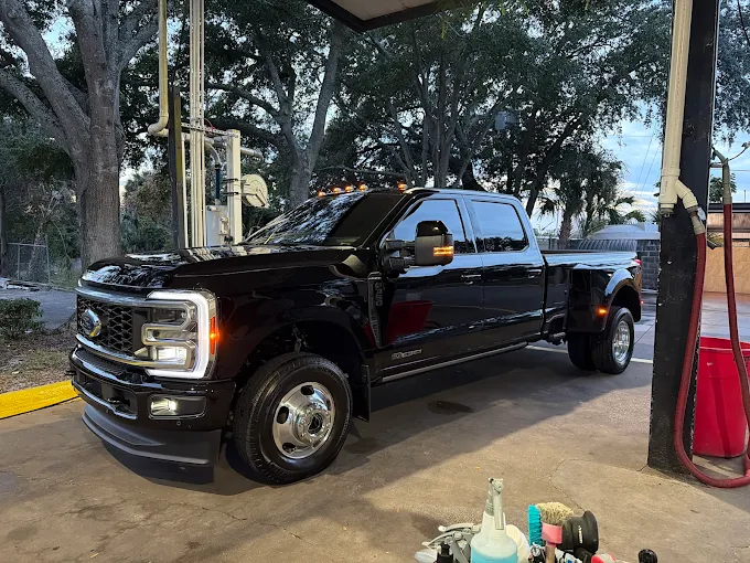 Black Ford F-350 dually pickup in detailing bay at Images Auto Spa Altamonte Springs