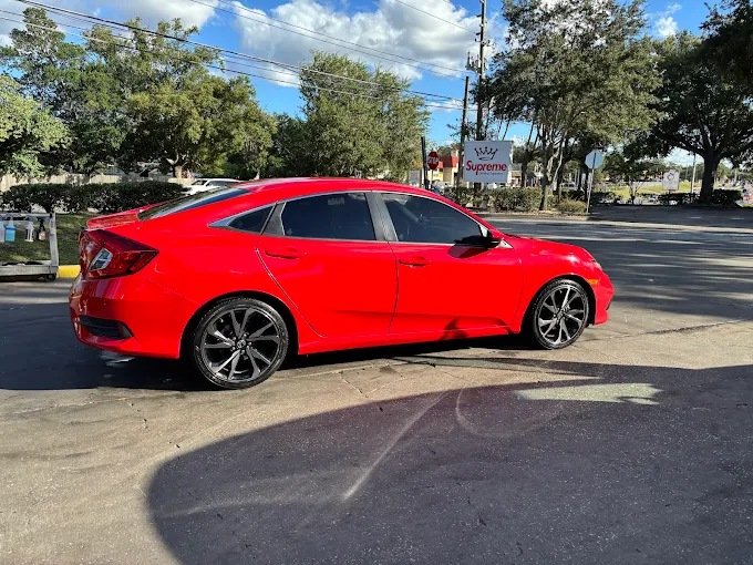 Red Honda Civic sedan after detailing at Images Auto Spa Altamonte Springs