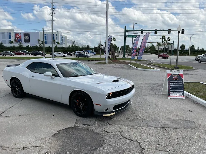 White Dodge Challenger at AJS Auto Spa on Sand Lake Road