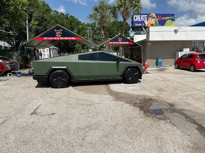 Matte green Tesla Cybertruck at AJS Auto Spa in Orlando