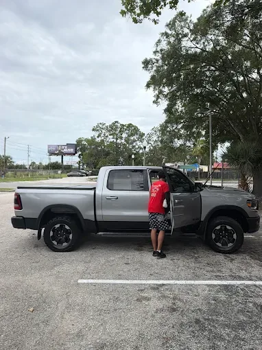 Silver Ram pickup hand wash at AJS Auto Spa
