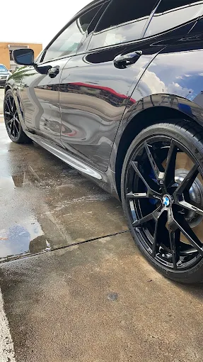 Black BMW close-up showing detail finish at Orlando hand wash center