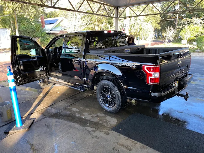 Black Ford F-150 rear view at Octopus Car Wash in Orlando