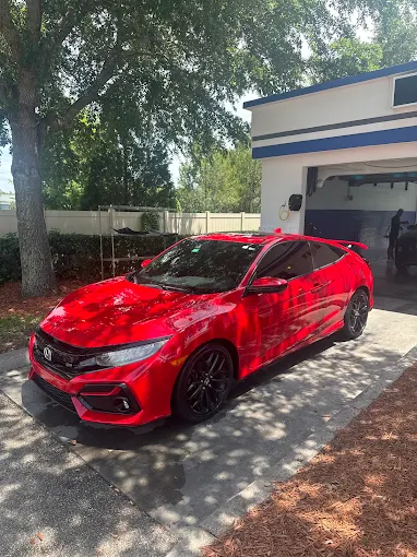 Red Honda coupe at Bullseye Auto Spa