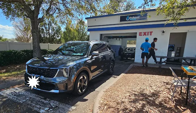 Black Kia SUV after wash at Bullseye Auto Spa in Orlando