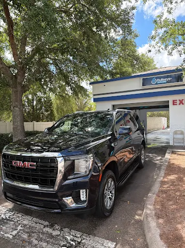 Black GMC Yukon SUV at Bullseye Auto Spa hand car wash