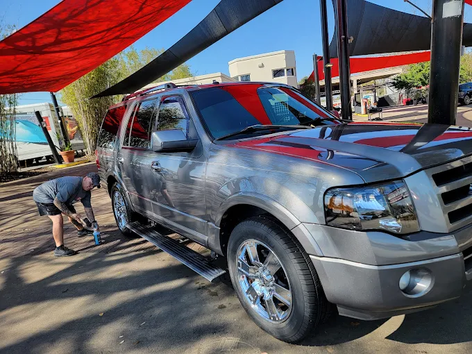 Silver Ford SUV being detailed at Images Auto Spa
