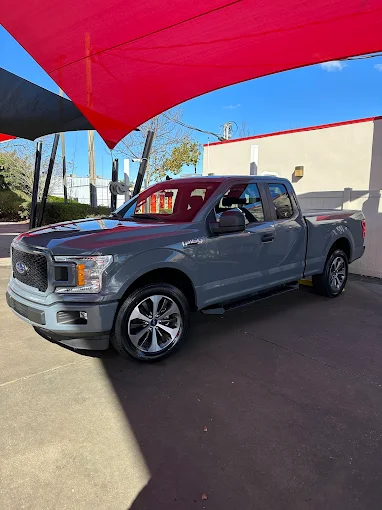 Gray Ford pickup truck under canopy at Images Auto Spa