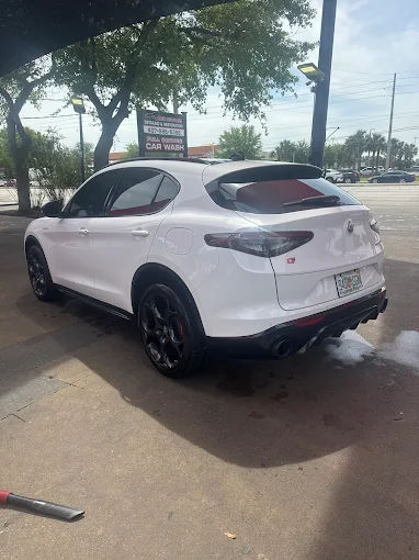 White Alfa Romeo sedan after detailing at Images Auto Spa