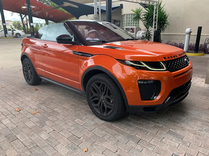 Orange Range Rover SUV at Images Auto Spa in Orlando