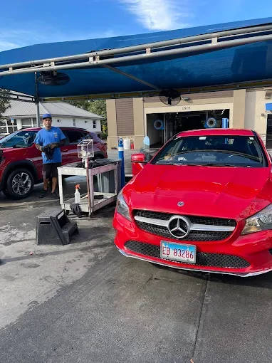 Red Mercedes at Octopus Car Wash Plant City hand-dry service area