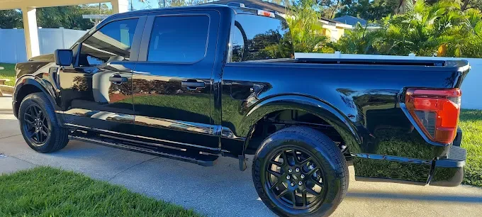 Black pickup truck after wash at Octopus Car Wash Plant City