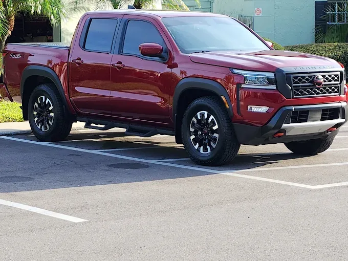 Red pickup truck after wash at Octopus Car Wash Plant City